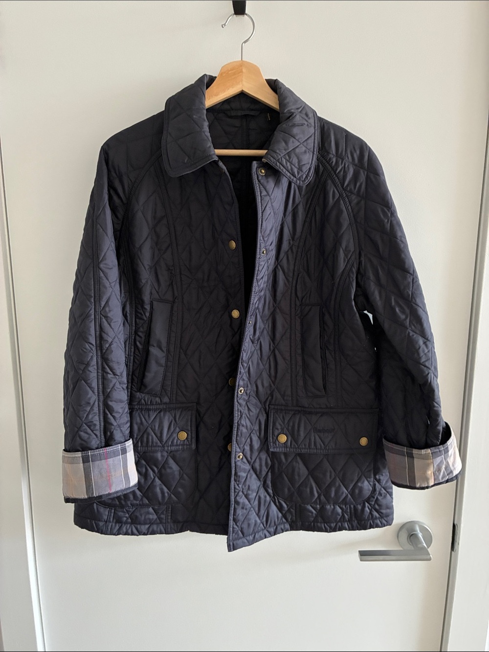 Barbour Navy Quilted Jacket with Plaid Cuff Detail
